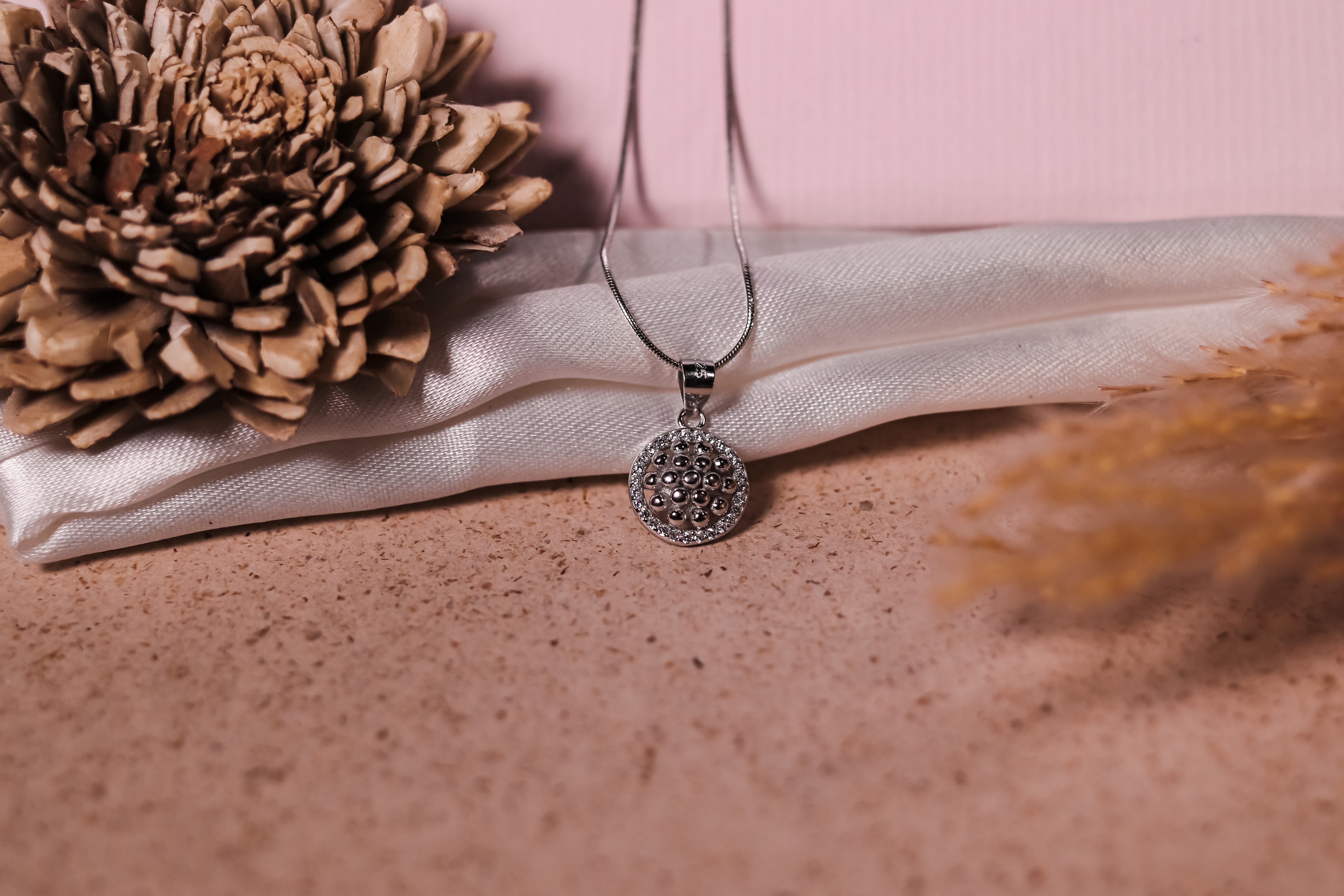 Sterling silver chain pendant with detailed beaded design and crystal embellishments