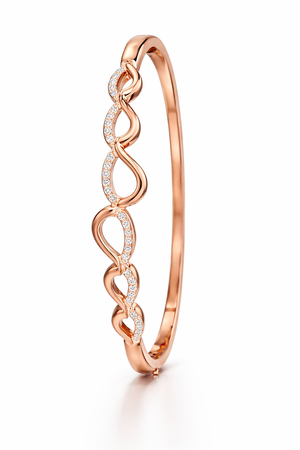 Rose gold plated sterling silver hinged bangle featuring a modern pave-set cubic zirconia wave design."