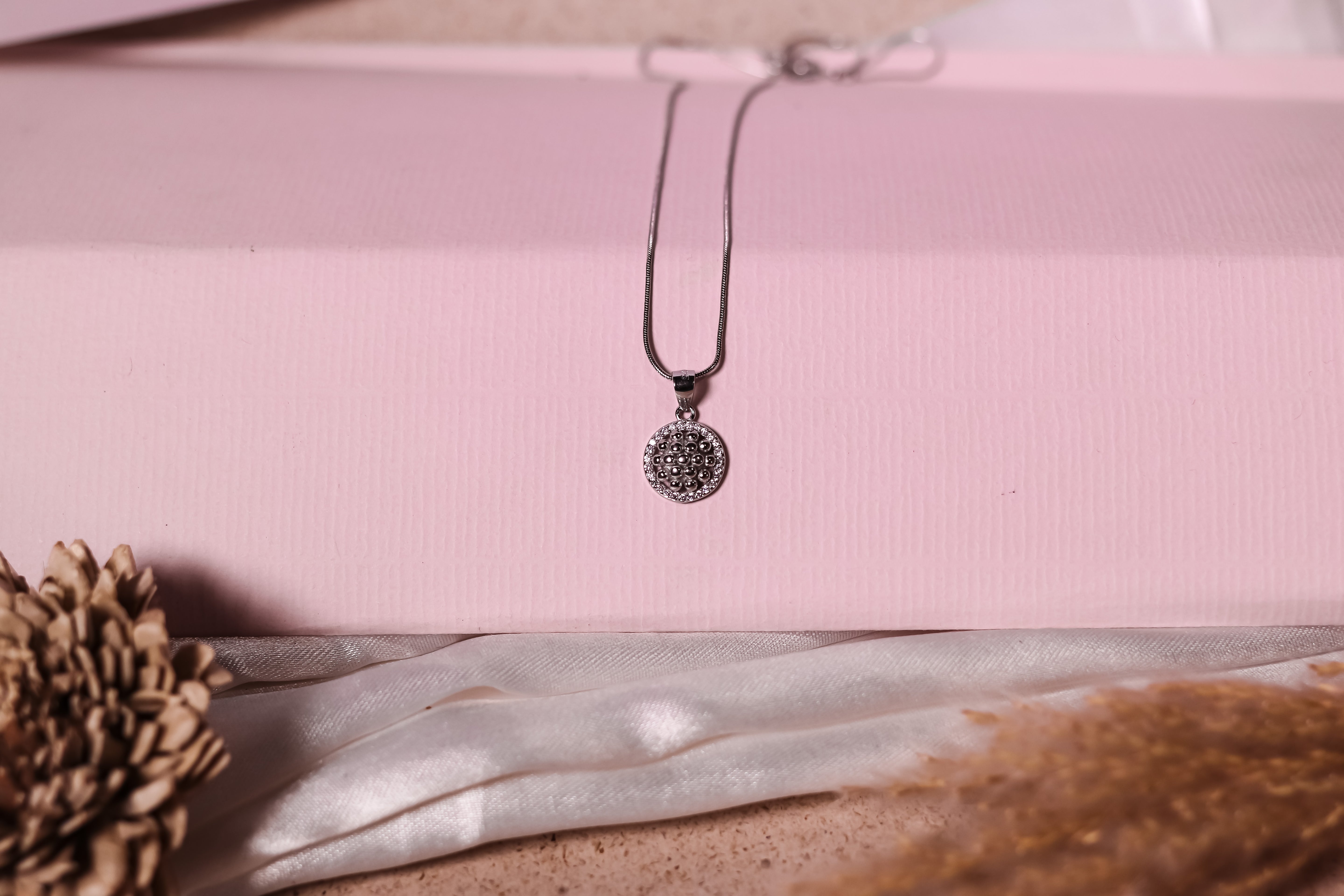 Sterling silver chain pendant with detailed beaded design and crystal embellishments